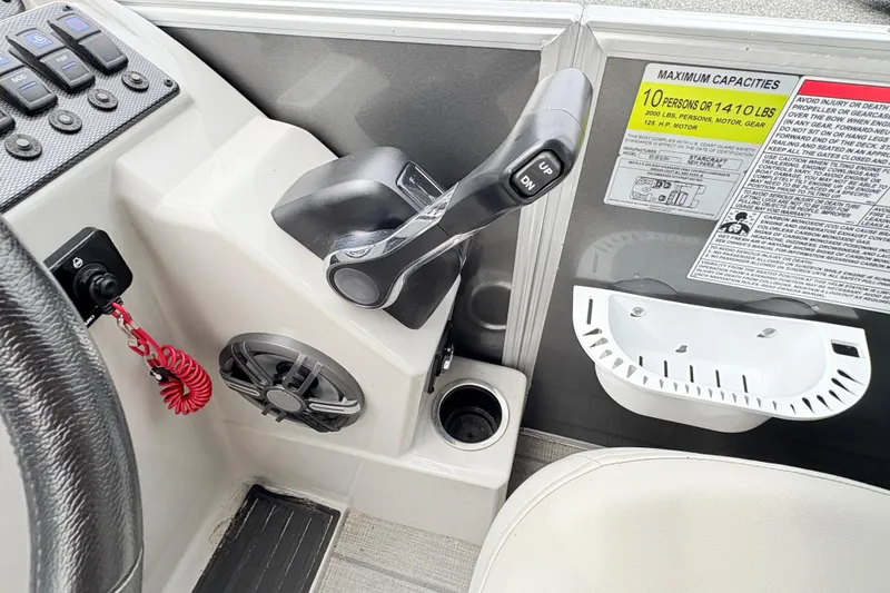 Slide: The Image of Storage compartment of 2024 Starcraft 20 EX QDH boat, containing black fabric. - 12