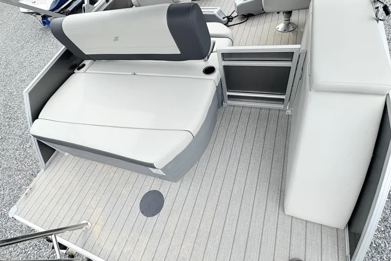 Slide: The Image of 2024 Starcraft 20 EX QDH boat with Suzuki outboard motor on a textured deck. - 8