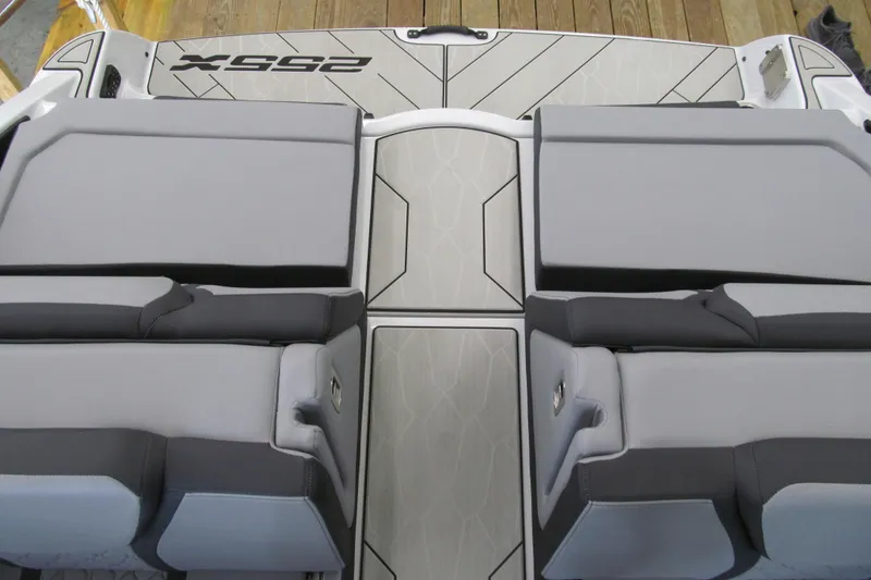 Slide: The Image of 2025 Yamaha Boats 255XD interior seating with sleek, modern design and comfortable upholstery. - 13
