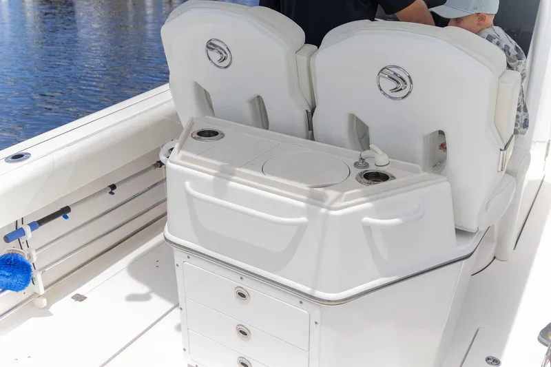 Slide: The Image of 2023 Edgewater 262CC boat interior with seating and storage compartments. - 13