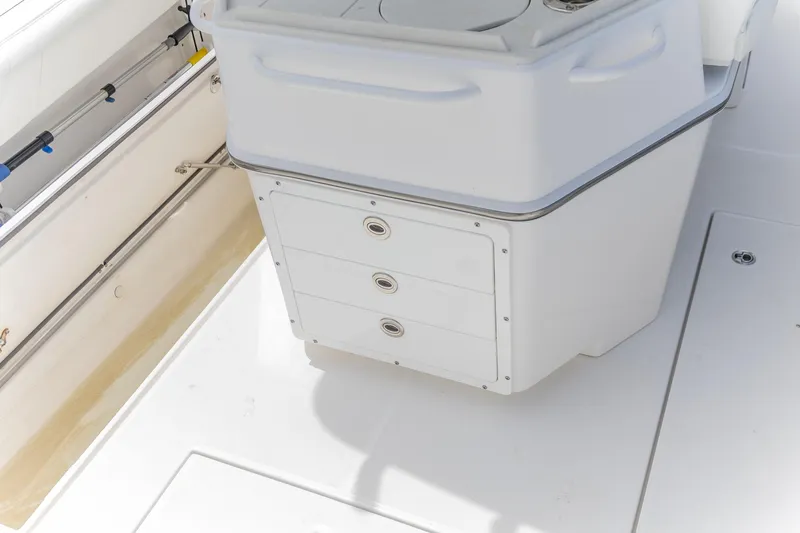 Slide: The Image of 2023 Edgewater 262CC boat interior with storage drawers and clean deck. - 16