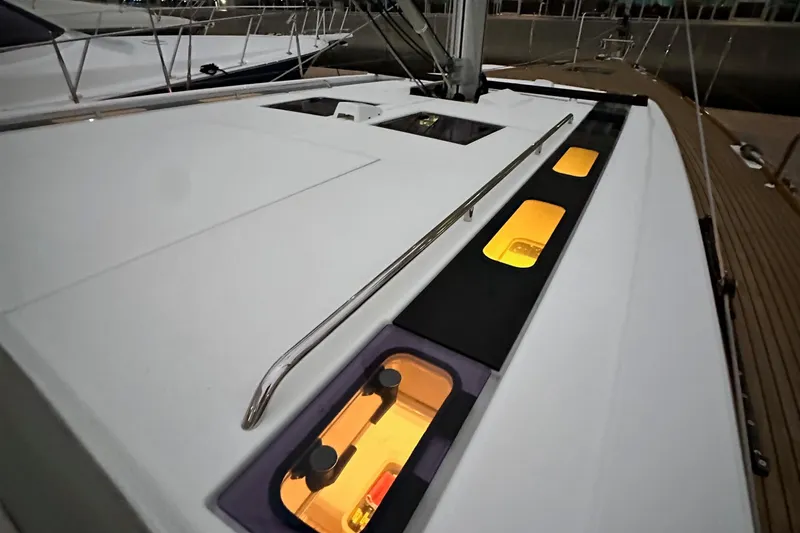 Slide: The Image of Beneteau Oceanis 55.1 yacht deck with illuminated windows, 2021 model. - 11