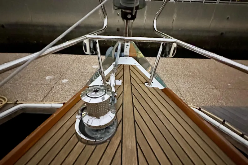 Slide: The Image of Bow view of 2021 Beneteau Oceanis 55.1 yacht with teak deck and stainless steel fittings. - 14