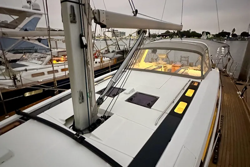 Slide: The Image of Beneteau Oceanis 55.1 yacht, 2021 model, docked at marina during evening. - 17