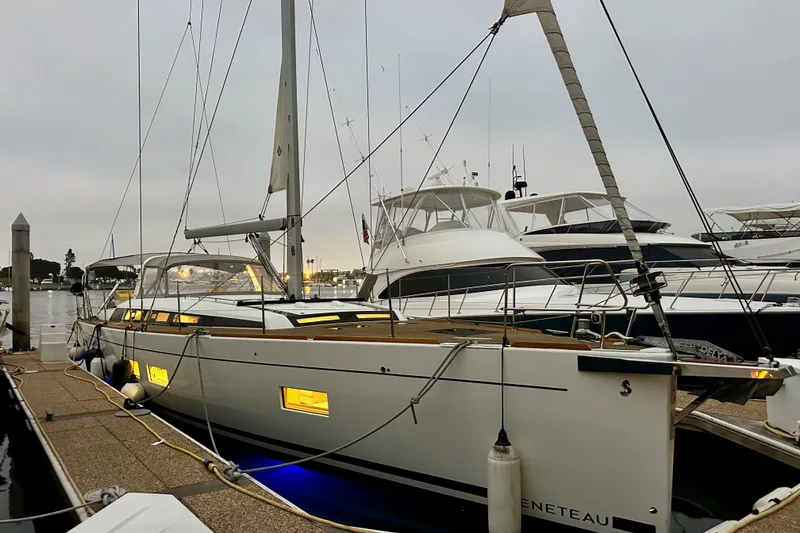 Slide: The Image of Beneteau Oceanis 55.1 yacht, 2021 model, docked at marina during evening. - 3