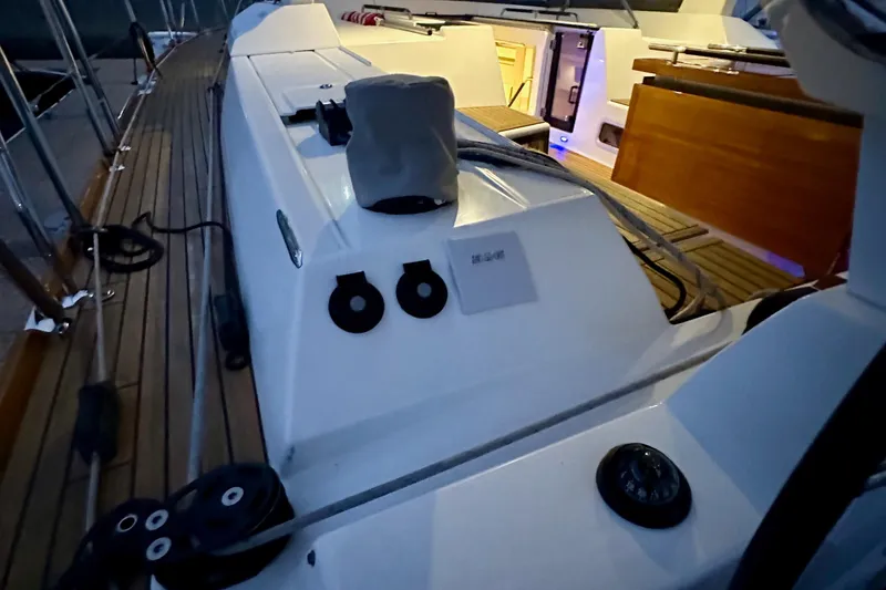 Slide: The Image of Deck view of 2021 Beneteau Oceanis 55.1 sailboat with wooden flooring and modern fittings. - 32