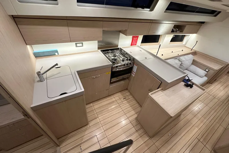 Slide: The Image of Modern kitchen interior of 2021 Beneteau Oceanis 55.1 yacht with sleek design and wood finish. - 41