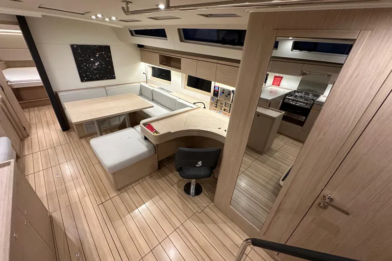 Slide: The Image of Luxurious interior of 2021 Beneteau Oceanis 55.1 yacht with modern kitchen and dining area. - 42