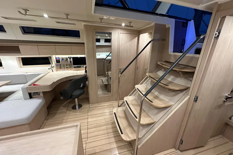 Slide: The Image of Luxurious interior of 2021 Beneteau Oceanis 55.1 yacht with modern design and wooden finishes. - 51