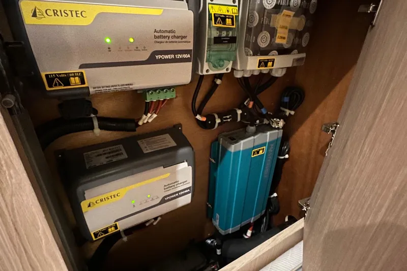 Slide: The Image of Electrical system components inside a 2021 Beneteau Oceanis 55.1 yacht. - 55