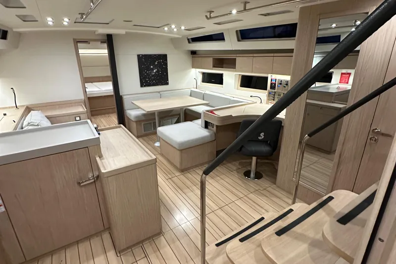 Slide: The Image of Luxurious interior of 2021 Beneteau Oceanis 55.1 yacht with modern furnishings and sleek design. - 56