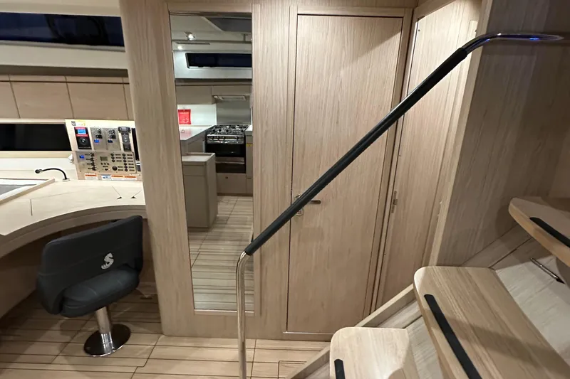 Slide: The Image of Interior of 2021 Beneteau Oceanis 55.1 yacht with modern design and wooden finishes. - 57