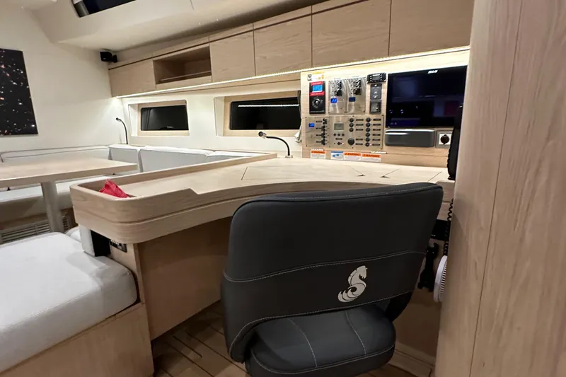 Slide: The Image of Luxurious interior of 2021 Beneteau Oceanis 55.1 yacht with modern navigation station. - 64