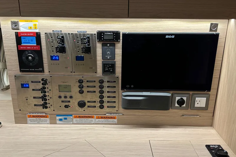 Slide: The Image of Control panel of a 2021 Beneteau Oceanis 55.1 yacht with navigation and electrical systems. - 66