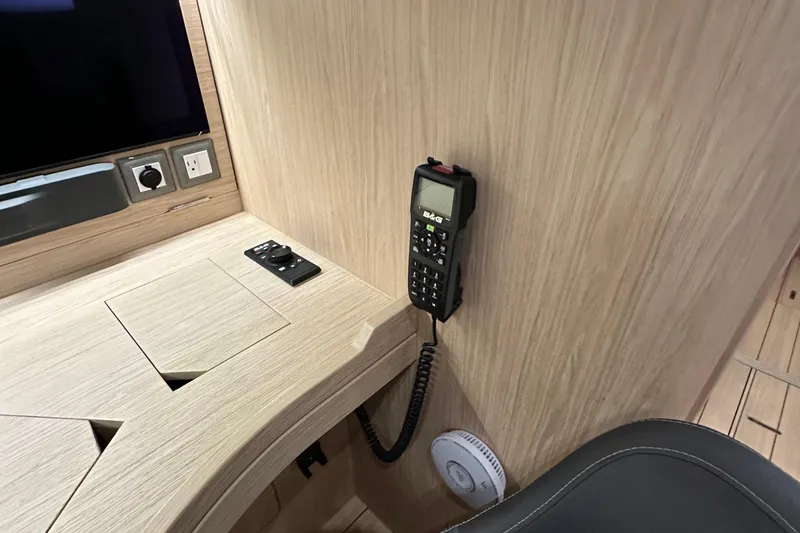 Slide: The Image of Interior of 2021 Beneteau Oceanis 55.1 yacht with communication device and control panel. - 69