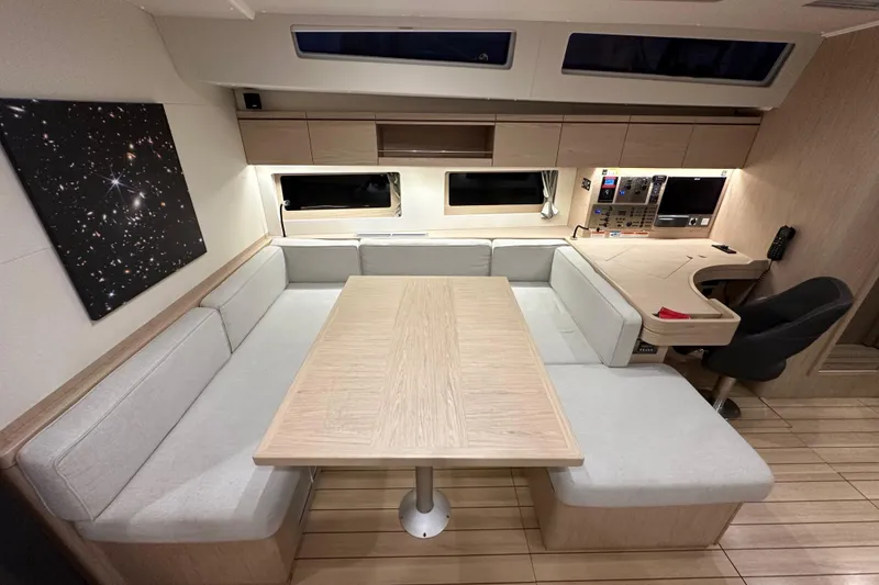 Slide: The Image of Modern interior of 2021 Beneteau Oceanis 55.1 yacht with spacious seating and navigation area. - 73
