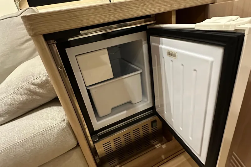 Slide: The Image of Compact refrigerator in Beneteau Oceanis 55.1 yacht interior, 2021 model. - 74