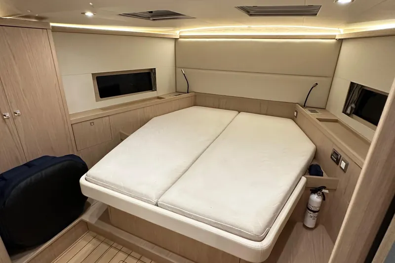 Slide: The Image of Luxurious cabin interior of 2021 Beneteau Oceanis 55.1 yacht, featuring a spacious bed. - 81