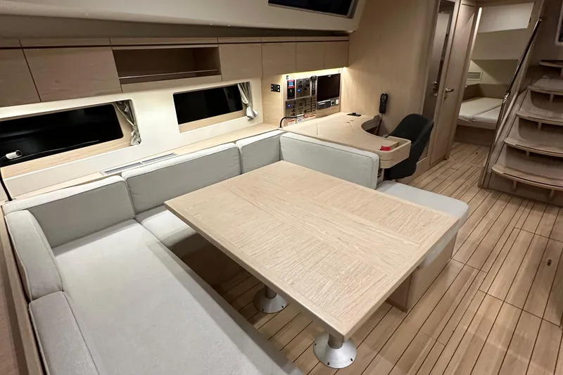 Slide: The Image of Modern interior of 2021 Beneteau Oceanis 55.1 yacht with elegant wood finish and seating area. - 86