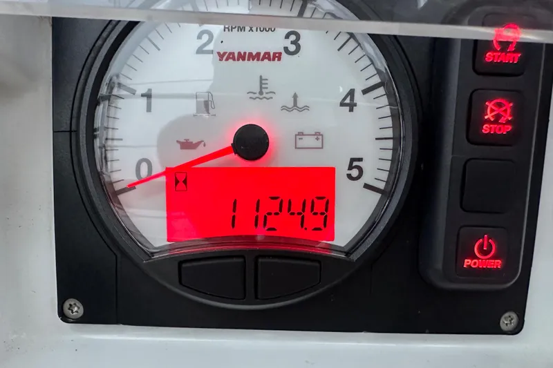Slide: The Image of Yanmar engine gauge on 2021 Beneteau Oceanis 55.1, displaying 1124.9 hours. - 90