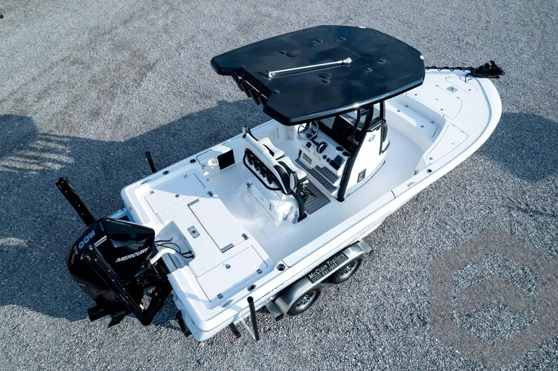 Slide: The Image of 2026 Tidewater 2410 Bay Max boat on trailer, featuring a sleek design and Mercury engine. - 100