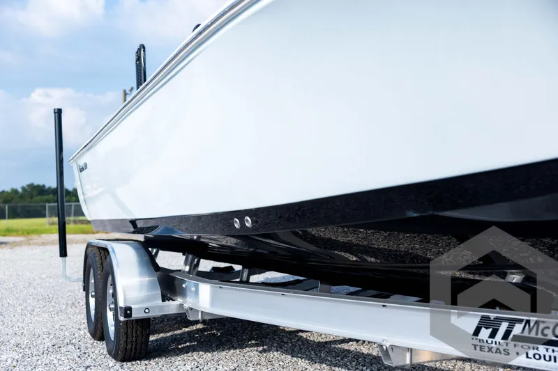 Slide: The Image of 2026 Tidewater 2410 Bay Max boat on trailer, side view, outdoors. - 11