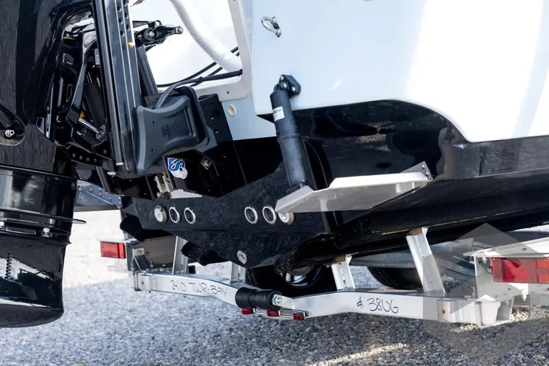 Slide: The Image of 2026 Tidewater 2410 Bay Max boat trailer and engine detail, showcasing modern design. - 16
