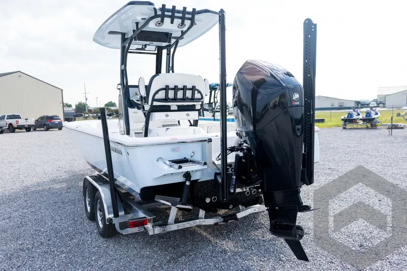 Slide: The Image of 2026 Tidewater 2410 Bay Max boat on trailer, featuring powerful outboard motor. - 17