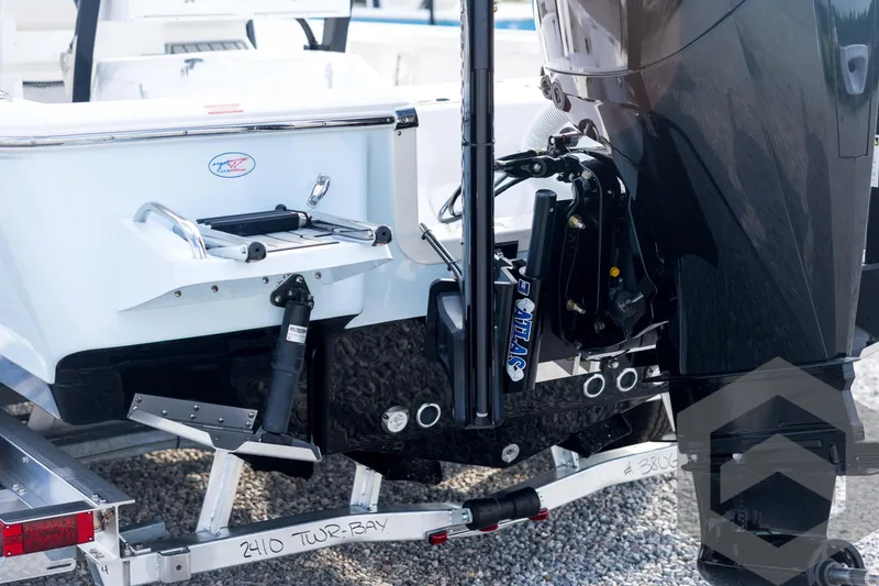Slide: The Image of 2026 Tidewater 2410 Bay Max boat on trailer, featuring powerful outboard motor. - 18