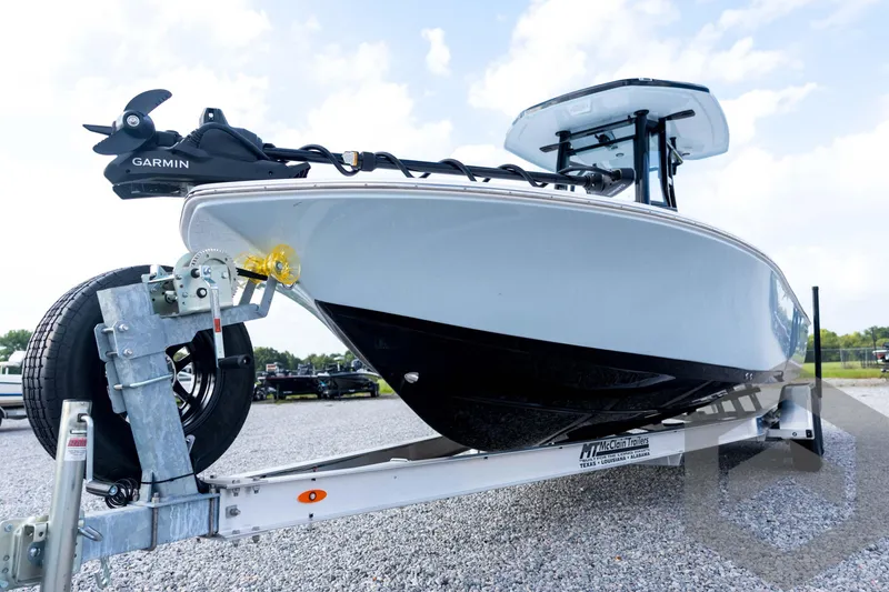 Slide: The Image of 2026 Tidewater 2410 Bay Max boat on trailer, featuring Garmin equipment, parked on gravel. - 30