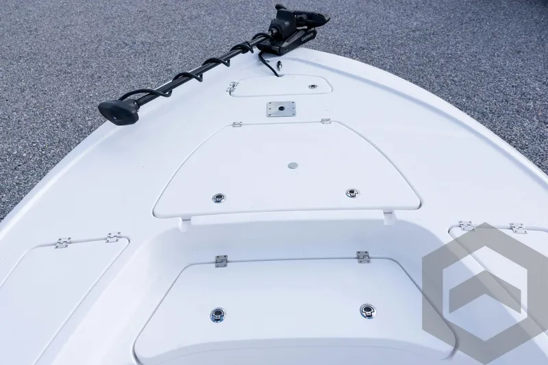 Slide: The Image of 2026 Tidewater 2410 Bay Max boat deck with storage compartments and trolling motor. - 33