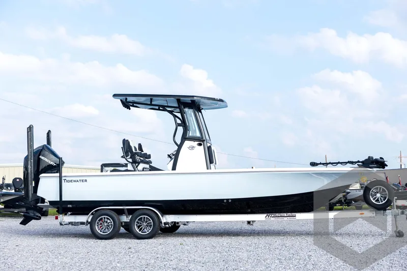 Slide: The Image of 2026 Tidewater 2410 Bay Max boat on trailer, side view, under clear sky. - 4