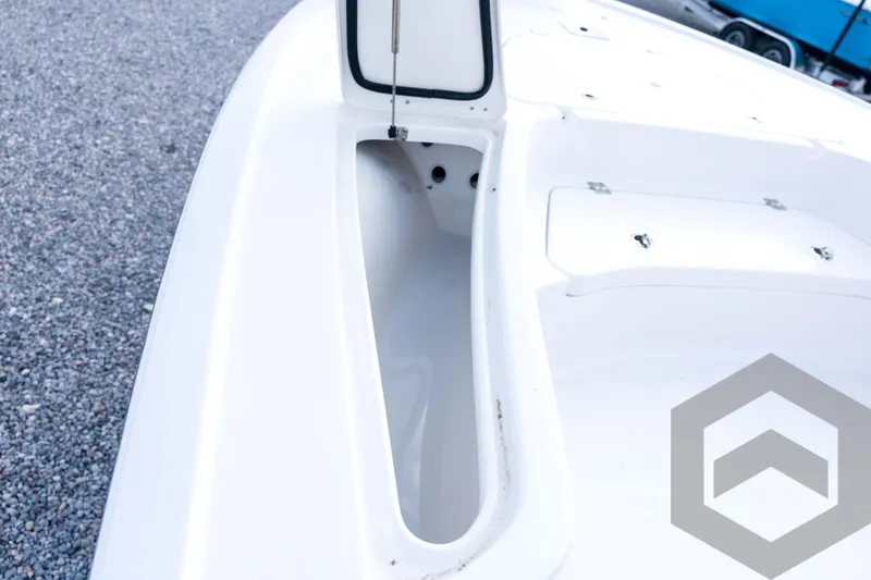 Slide: The Image of 2026 Tidewater 2410 Bay Max boat deck with open storage compartment. - 41