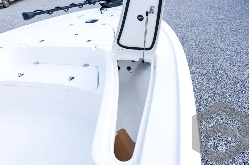 Slide: The Image of 2026 Tidewater 2410 Bay Max boat with open storage compartment on deck. - 42