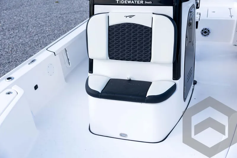 Slide: The Image of 2026 Tidewater 2410 Bay Max boat interior with cushioned seating and sleek design. - 43