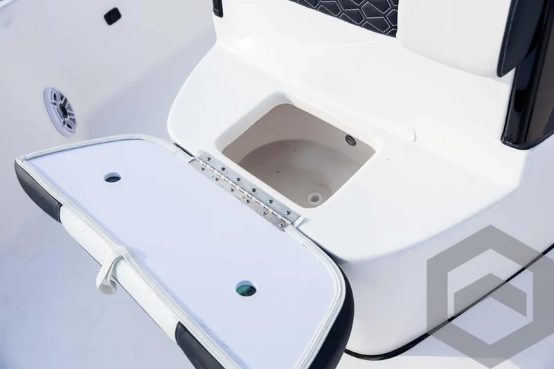 Slide: The Image of Open storage compartment on 2026 Tidewater 2410 Bay Max boat, featuring sleek design. - 44