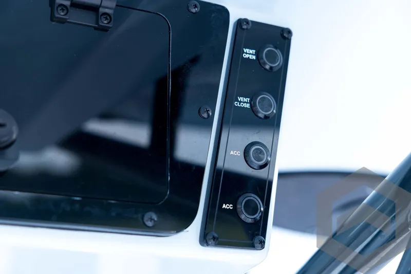 Slide: The Image of Control panel of 2026 Tidewater 2410 Bay Max boat with vent and accessory buttons. - 58