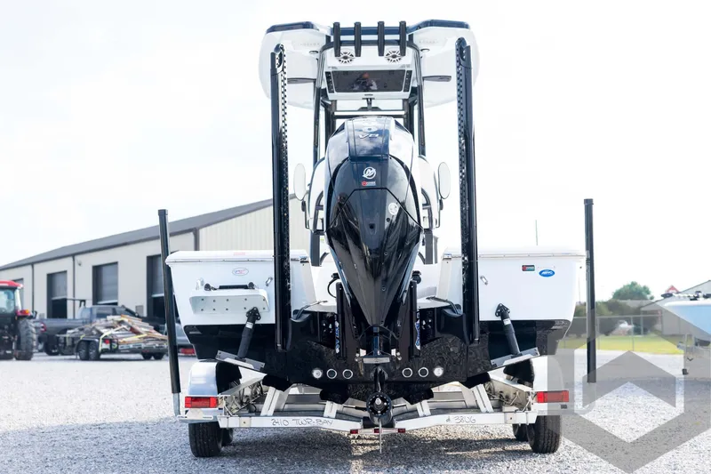 Slide: The Image of 2026 Tidewater 2410 Bay Max boat on trailer, rear view, outdoor setting. - 6