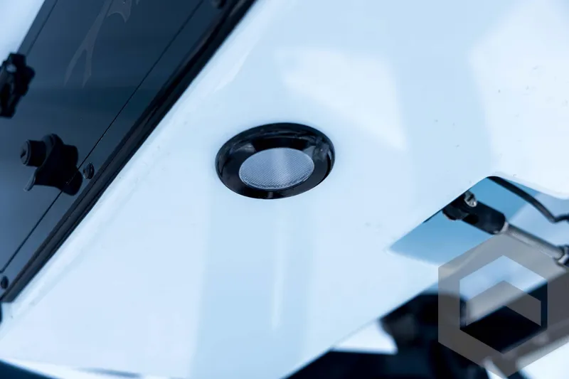 Slide: The Image of Close-up of 2026 Tidewater 2410 Bay Max boat detail, featuring sleek design elements. - 60