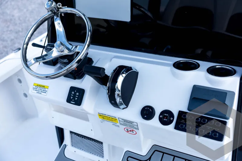 Slide: The Image of 2026 Tidewater 2410 Bay Max boat console with steering wheel and controls. - 62