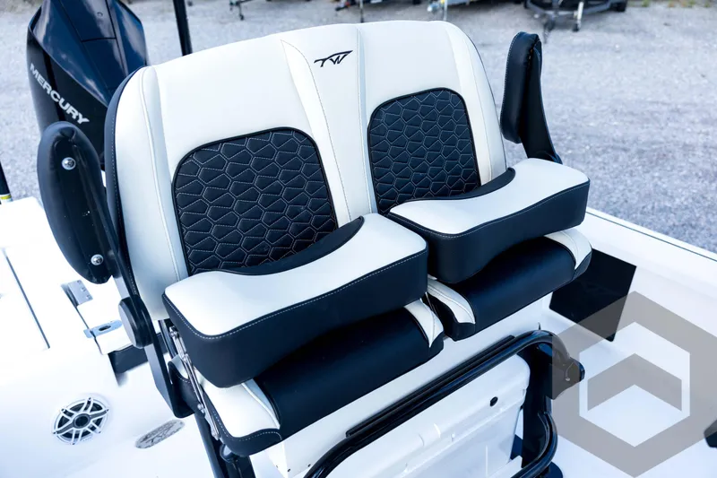 Slide: The Image of 2026 Tidewater 2410 Bay Max boat seats with black and white upholstery, featuring a hexagonal pattern. - 69