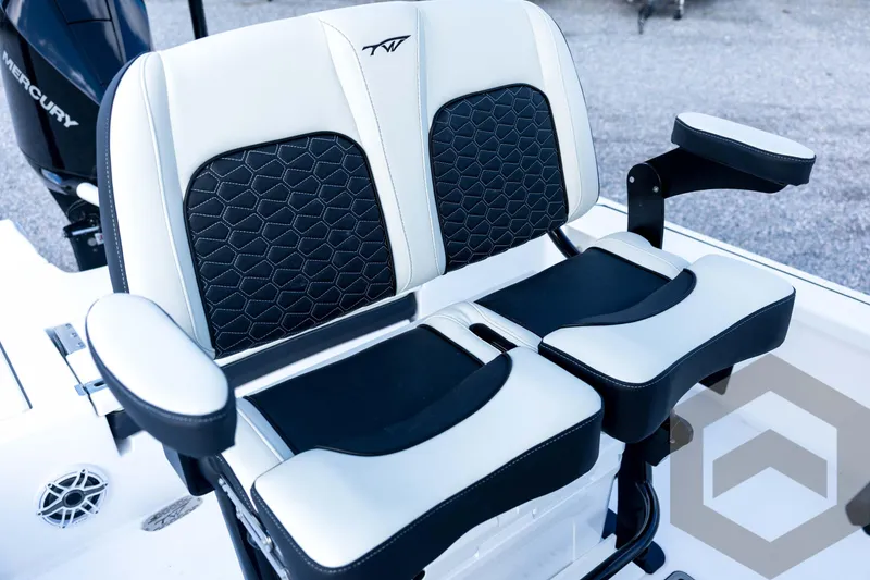 Slide: The Image of 2026 Tidewater 2410 Bay Max boat seat with black and white cushioned design. - 70