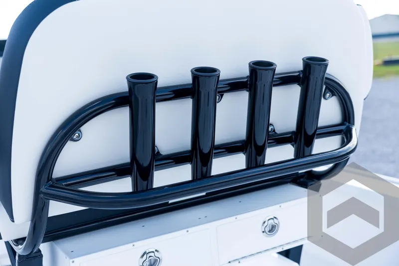 Slide: The Image of Tidewater 2410 Bay Max 2026 boat seat with black rod holders and storage compartments. - 74