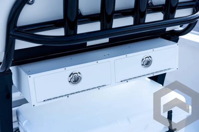 Slide: The Image of 2026 Tidewater 2410 Bay Max boat storage compartments with secure latches and sleek design. - 75