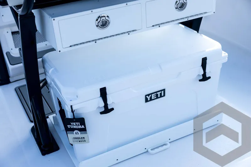 Slide: The Image of YETI Tundra cooler on 2026 Tidewater 2410 Bay Max boat deck. - 76