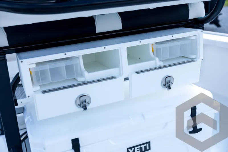 Slide: The Image of Tidewater 2410 Bay Max 2026 boat storage compartments with Yeti cooler. - 77