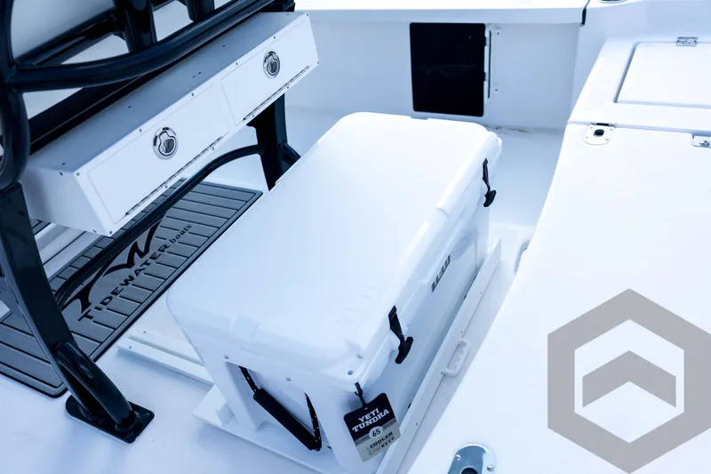 Slide: The Image of 2026 Tidewater 2410 Bay Max boat interior with Yeti cooler and storage drawers. - 78