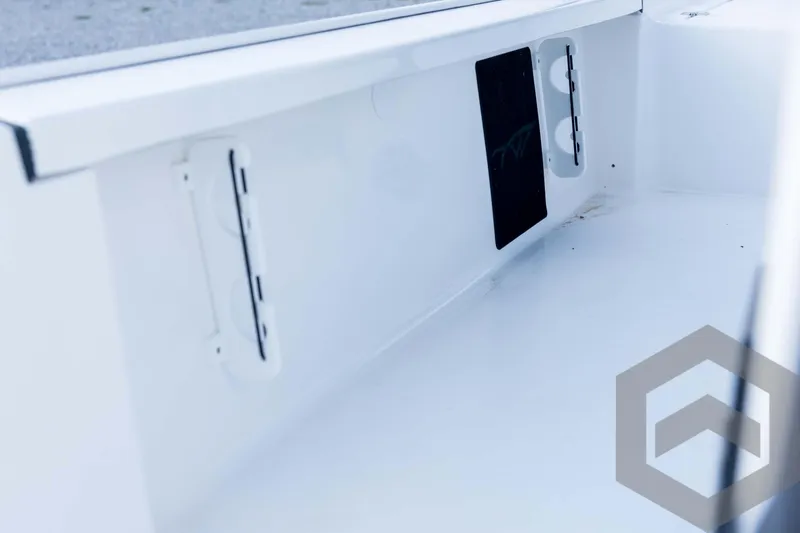 Slide: The Image of Interior view of 2026 Tidewater 2410 Bay Max boat, showcasing sleek white design. - 80