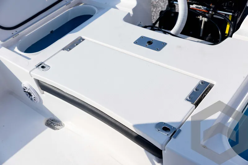 Slide: The Image of 2026 Tidewater 2410 Bay Max boat deck with storage compartment and livewell. - 85