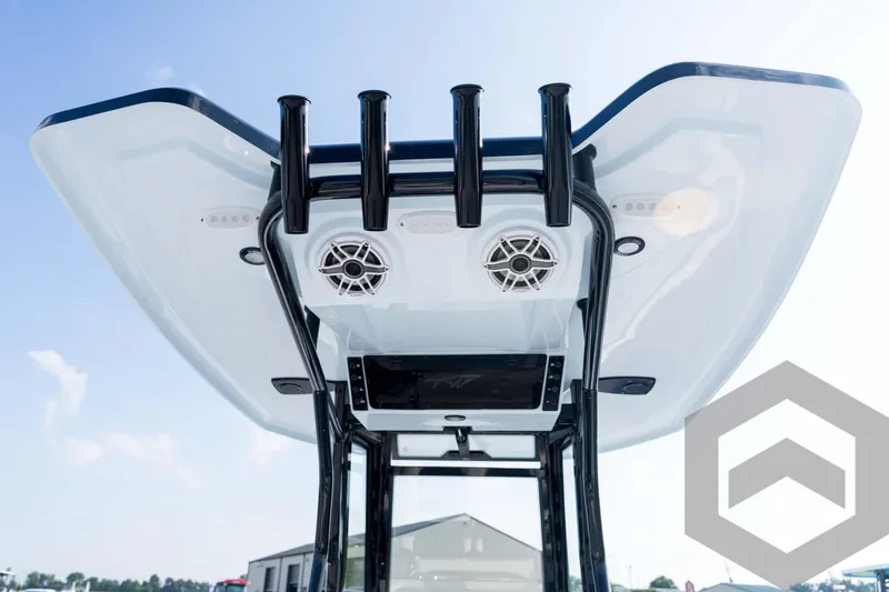Slide: The Image of Tidewater 2410 Bay Max 2026 boat T-top with speakers and rod holders, viewed from below. - 90